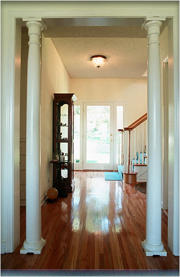 The stairway space to the second floor was taken from an existing bedroom. We matched the hardwood flooring that was typical throughout the home.